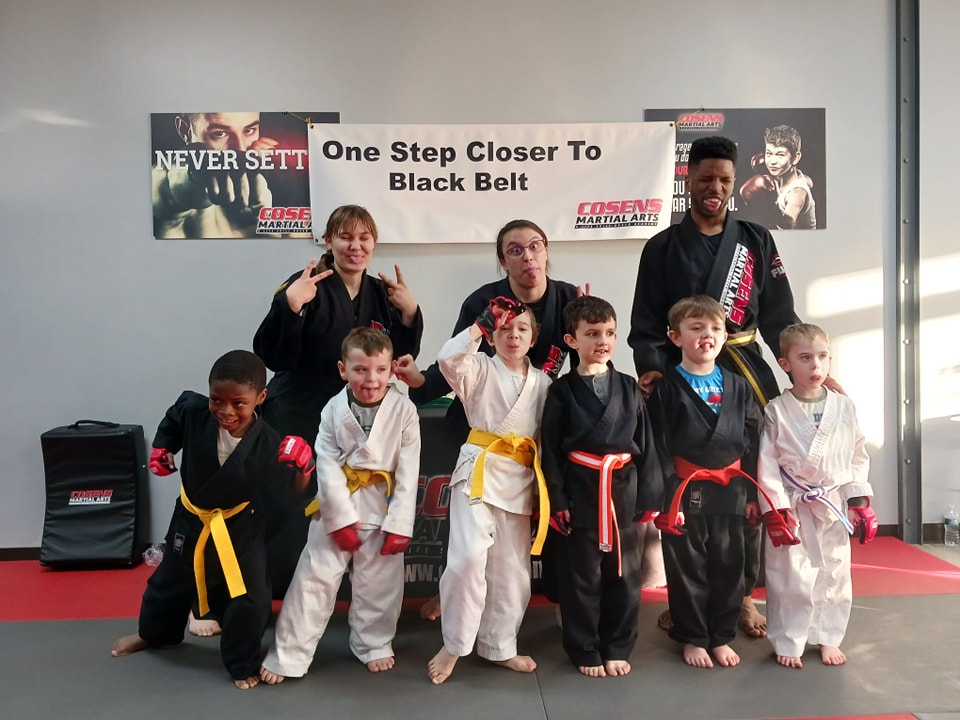 Children partnering up during karate class at Cosens Martial Arts in Oxford