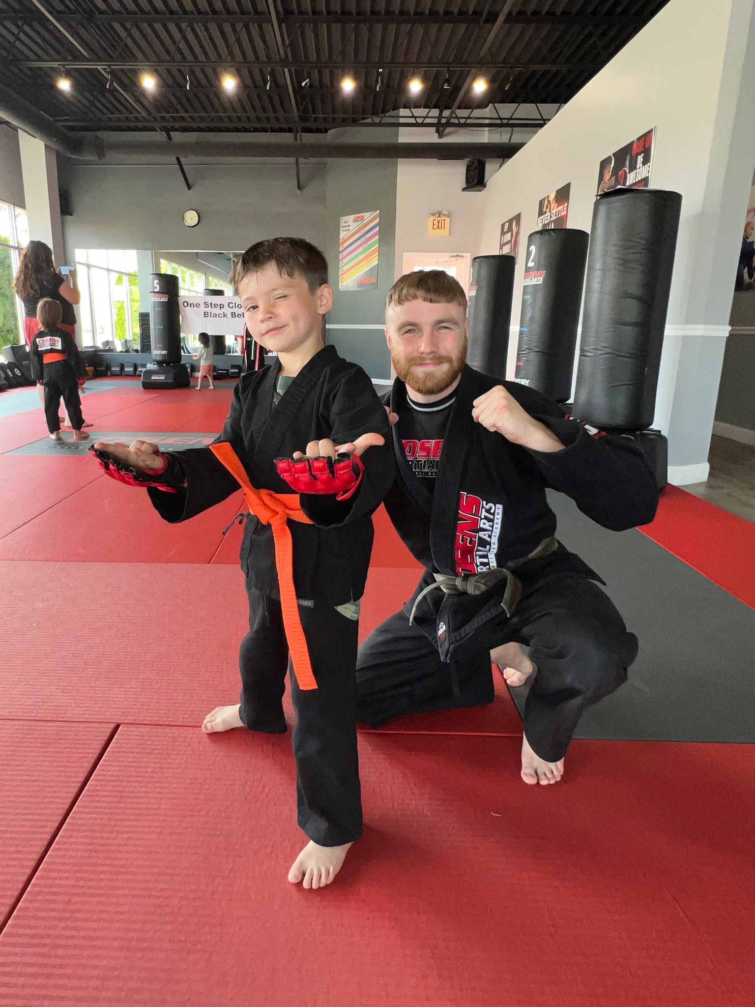 Children's martial arts student with a coach
