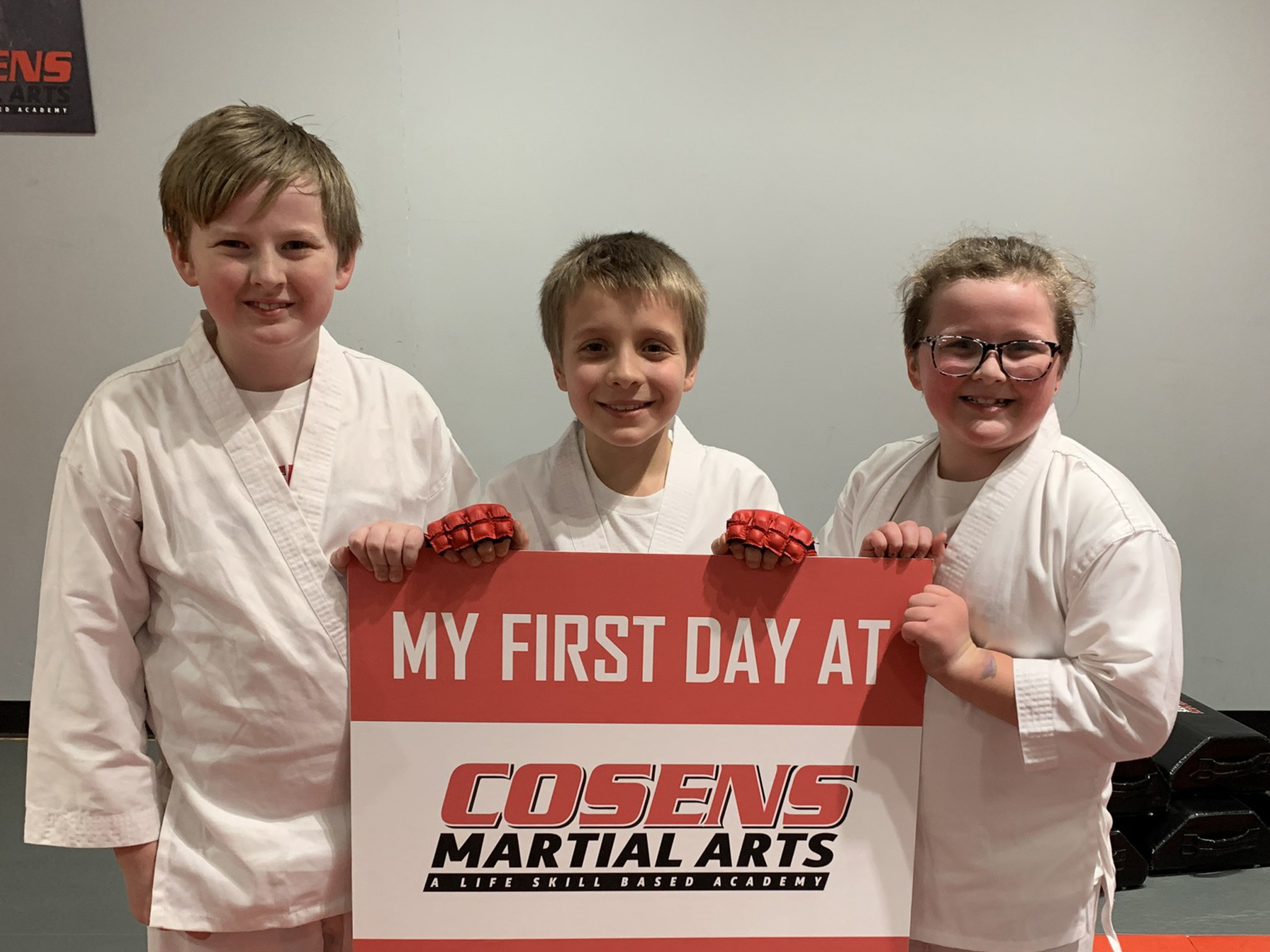 New martial arts students smiling on their first day
